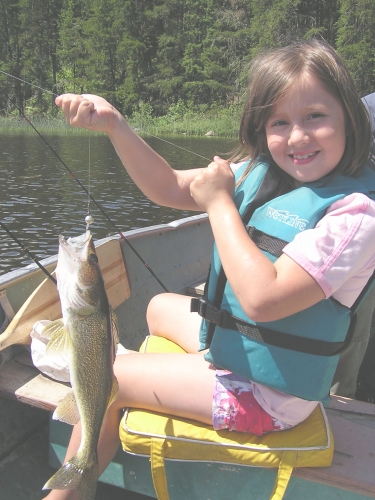 Want a great way to experience the outdoors with your kids - take them fishing! It was a great day and Tori proudly shows off her catch.  This was the walleye that won the tournament. Lucky Girl.

