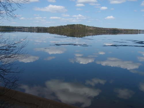 Crystal clear reflection of the sky on Wabaskang Lake.