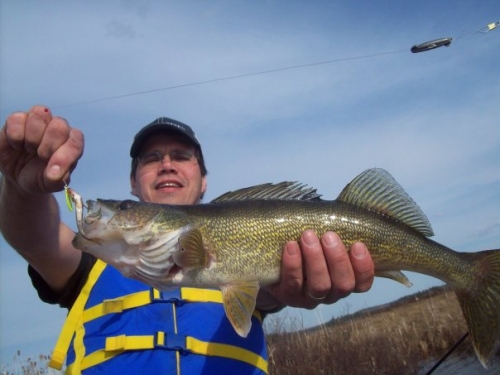 Bill Altenburg on Wabigoon Lake with his catch! Nothing beats a day on the lake in the Patricia Region.
