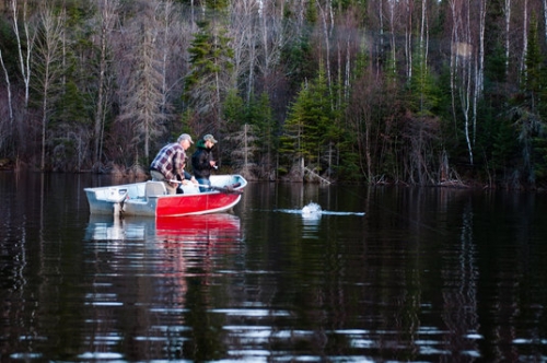 Some live action of two lucky fisherman catching a fish