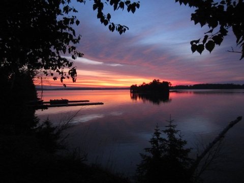 A warm looking sunset over the lake. 